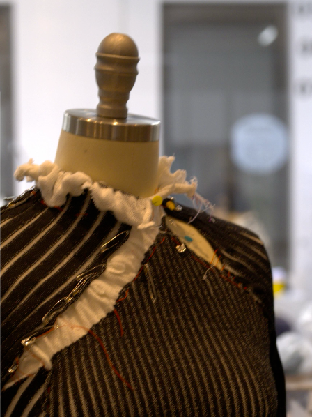 Knitwear development on a dress form at the atelier